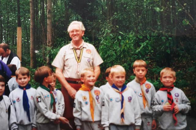 George (aged seven) pictured on the far right when he was in the Beavers 22 years ago and presented with an acorn by the chief scout.