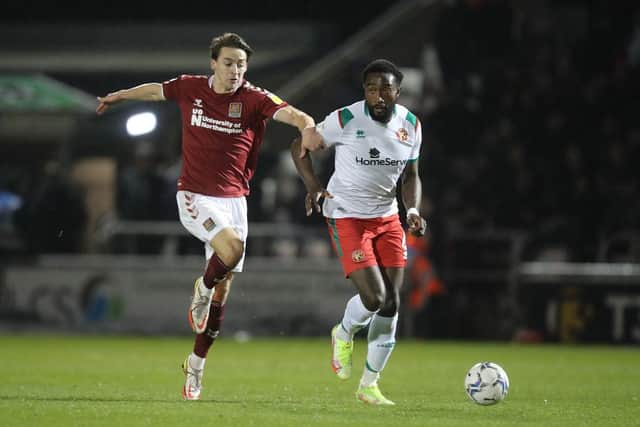 Louis Appere battles for possession in the Cobblers' 1-1 draw with Walsall at Sixfields