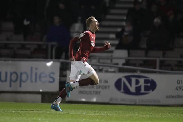 Mitch Pinnock celebrates firing the Cobblers into an early lead against Walsall (Pictures: Pete Norton)
