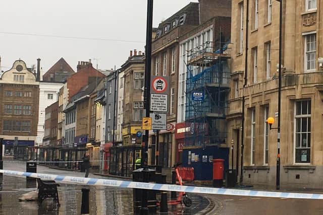 The man spent more than four hours perched on top of scaffolding outside the former Shipmans pub in Northampton town centre