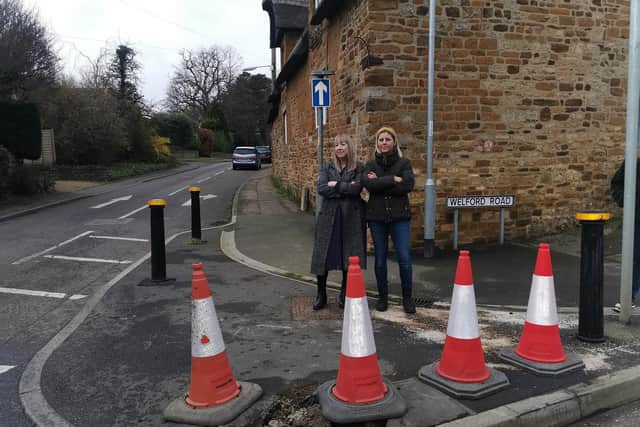 Katie and Suzie standing on the Welford Road/Pitsford Road crossroad