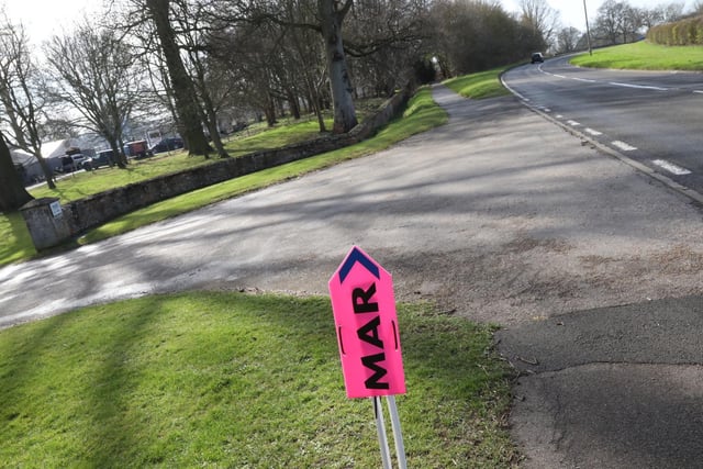 Pink signs have been placed to direct the crew to the correct entrance points to the estate