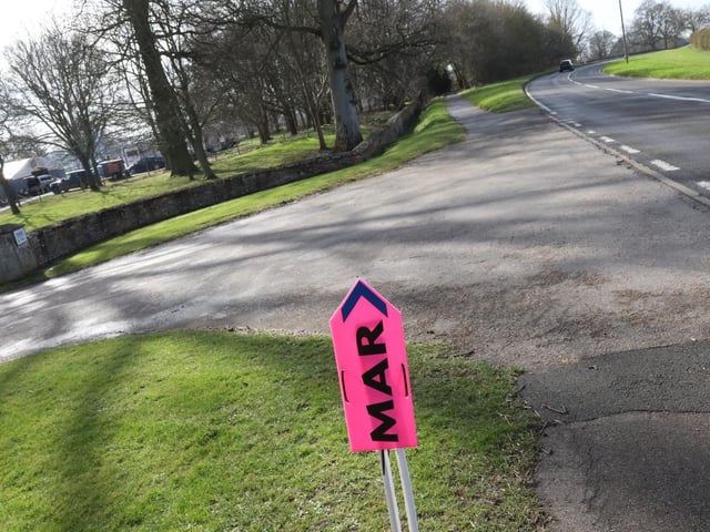 Pink signs have been placed to direct the crew to the correct entrance points to the estate