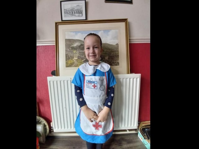 Adelaide Brown, aged five, dressed for the 'hero' theme at her school.