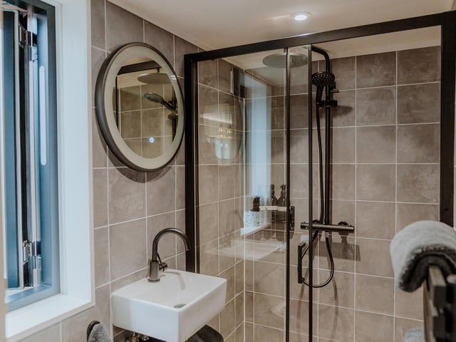 The bathroom includes a shower, toilet and sink - and bathroom toiletries are provided.