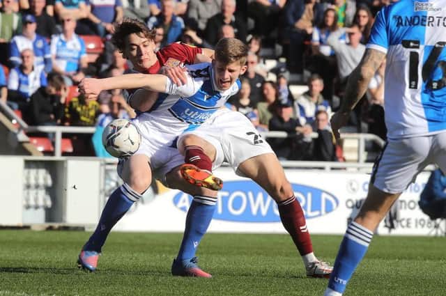 Louis Appere battles for the ball in the Cobblerrs' clash with Bristol Rovers