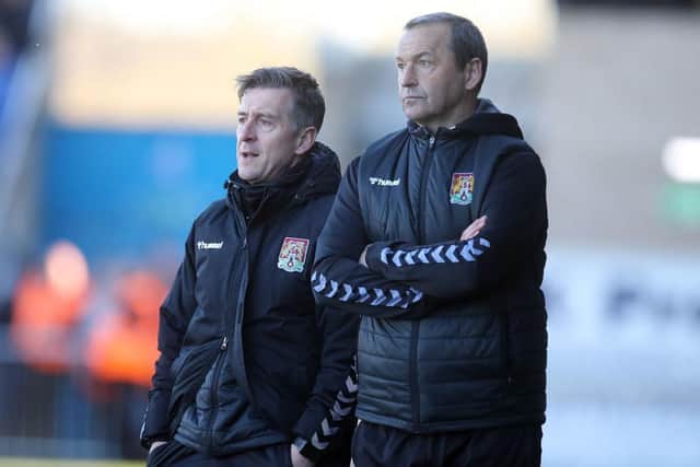Cobblers boss Jon Brady and his assistant Colin Calderwood watch on as Town are beaten 1-0 by Bristol Rovers