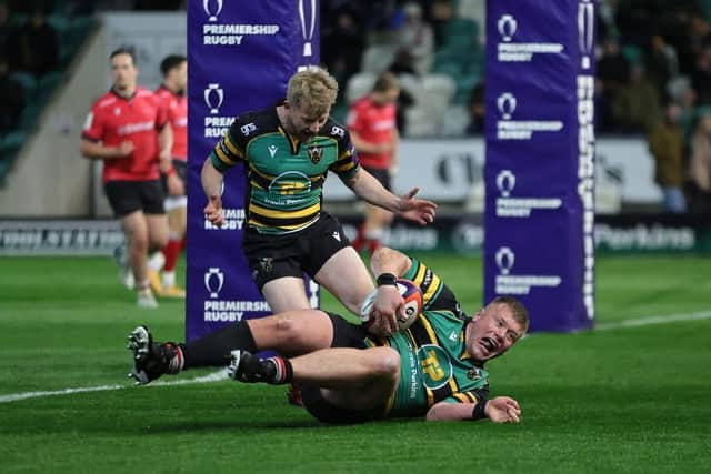 Reece Marshall shows his delight as he goes over for his try