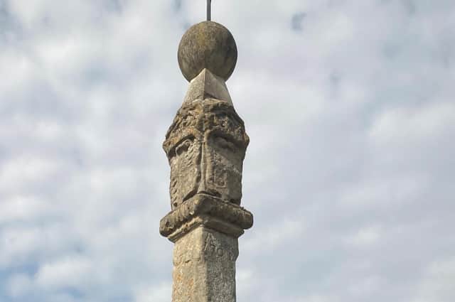The historic stone cross in Brigstock