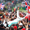 Lewis Hamilton celebrates with fans after winning the British Grand Prix at Silverstone in 2019. Photo: Getty Images