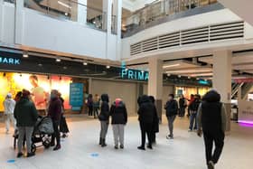 Shoppers queue outside Primark in Northampton Grosvenor Centre for 8am opening