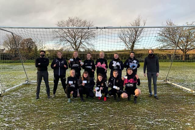 George (far left) and Leslie (far right) with the Northampton Town women's football team