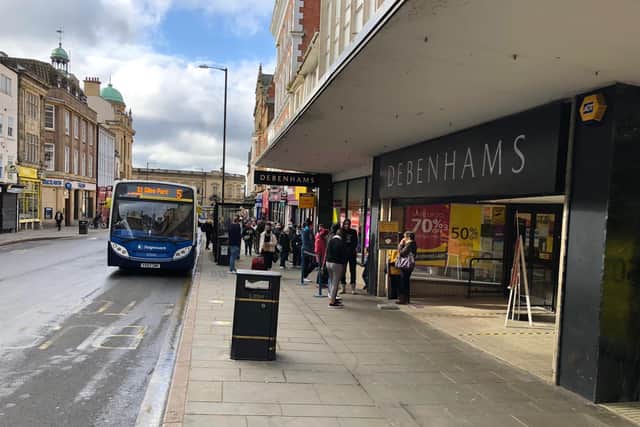 Shoppers queued outside Debenhams in the Drapery
