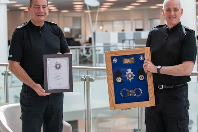 Chief Constable Nick Adderley bids a fond farewell to ACC James Andronov (right)