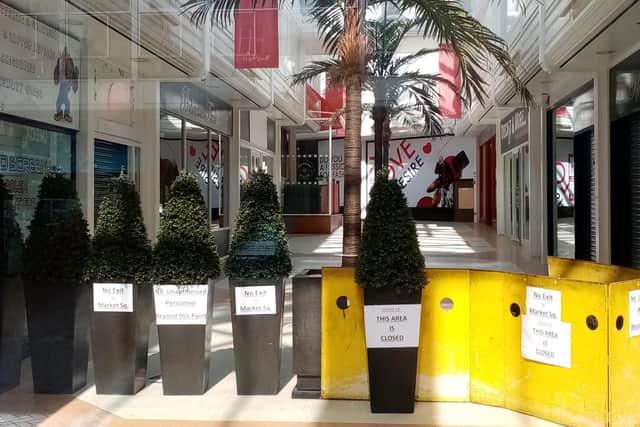 Market Walk as pictured through its locked entrance on Abington Street. The walkway through the shopping centre has been shut to the public since November.