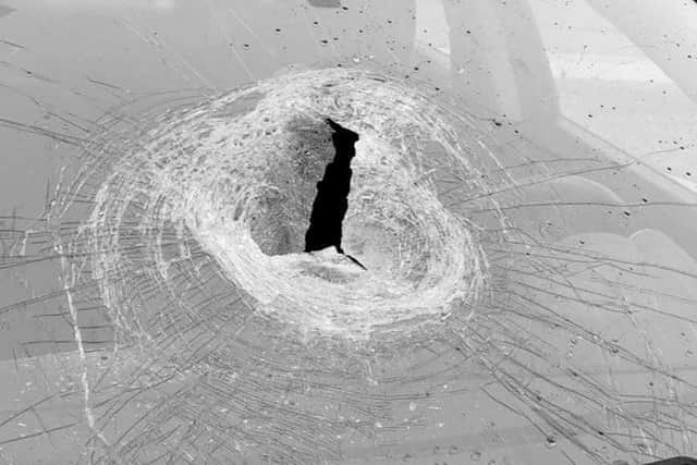 This photo shows the damage caused by a stone being dropped on to the windscreen of a car travelling at speed