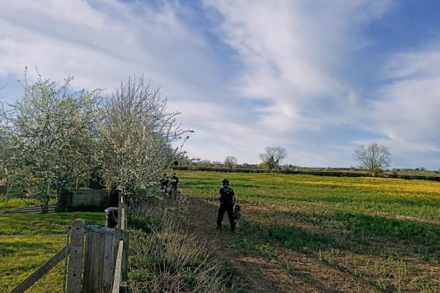 Armed police at the back of the house