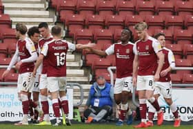 The Cobblers players celebrate Peter Kioso's second goal in the 3-0 win over Ipswich Town on Tuesday night (Pictures: Pete Norton)