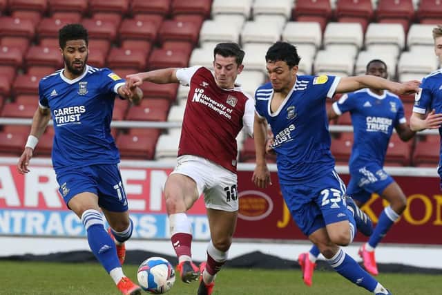 Alex Jones battles for possession in the Cobblers' win over Ipswich Town