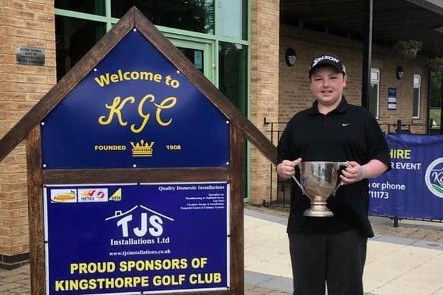Fourteen-year-old Sam Dunkley celebrating his victory at a men's golf tournament at Kingsthorpe Golf Club.