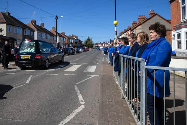 Friends and family of Sam Dunkley lined the streets, wearing his favourite colour blue, to pay their respects