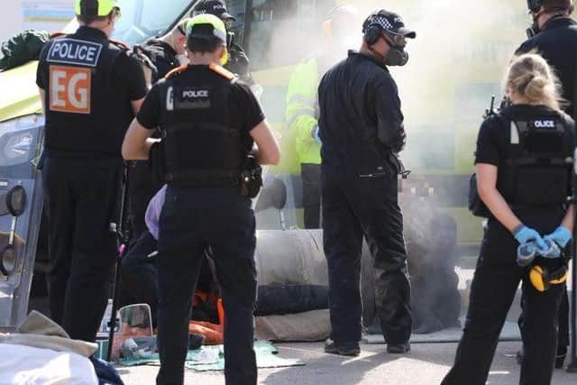 Police used cutting tools to free protesters outside the new Five Wells prison