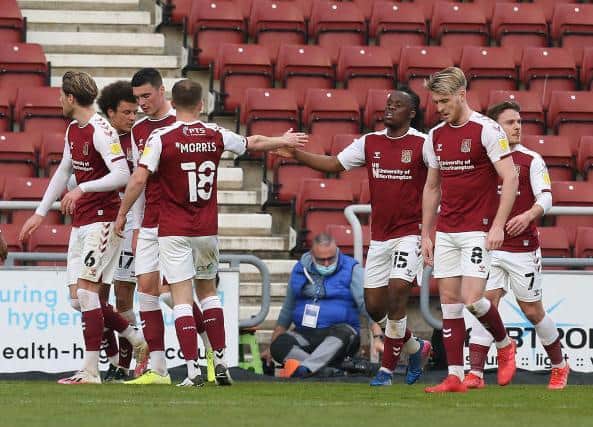 Cobblers celebrate Peter Kioso's second goal on Tuesday.