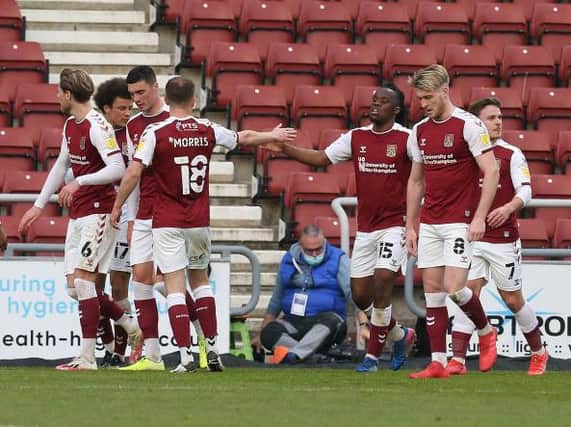 Cobblers celebrate Peter Kioso's second goal on Tuesday.