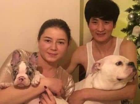 Julia Bradka and her boyfriend Ottie with their dogs before Winter was stolen.