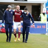 Joseph Mills couldn't put any weight on his ankle after suffering a painful injury in the early stages of Saturday's defeat to Blackpool. Picture: Pete Norton.