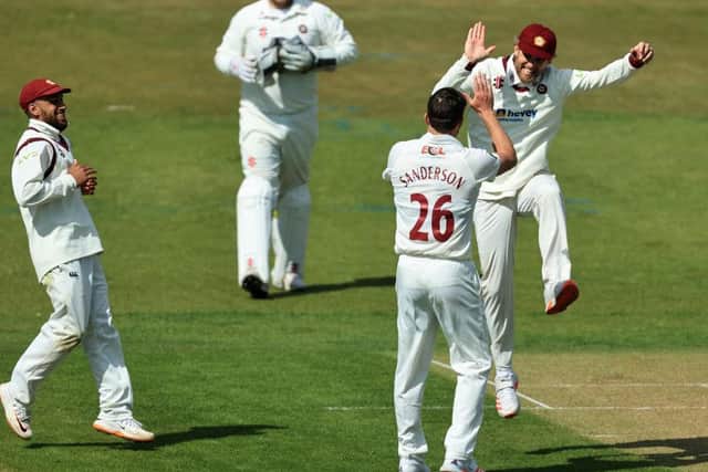 Gareth Berg high-fives Ben Sanderson after he claimed his fifth wicket
