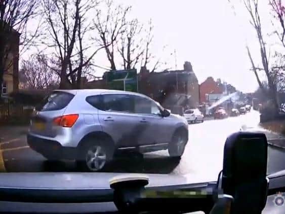 This car couldn't wait for a gap in traffic before pulling out of a side road