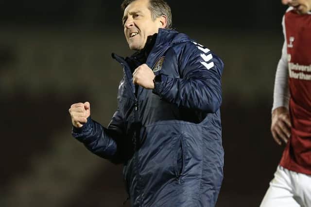 Jon Brady celebrates his first win as caretaker manager against Plymouth.