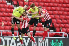 Fraser Horsfall and Lloyd Jones challenge for a header at the Stadium of Light. Pictures: Pete Norton.