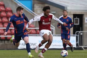 Caleb Chukwuemeka in action for the Cobblers