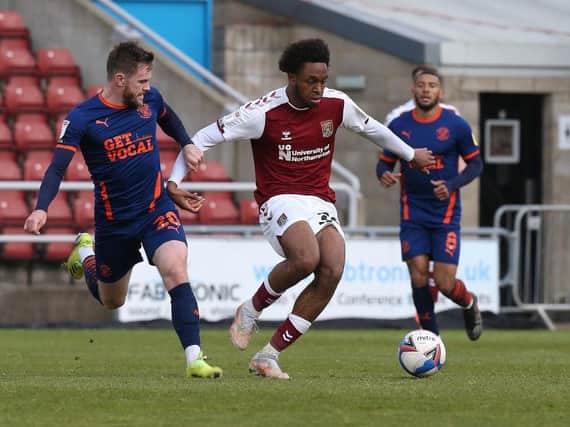 Caleb Chukwuemeka in action for the Cobblers