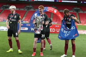 Callum Morton with the play-off trophy. Pictures: Pete Norton.