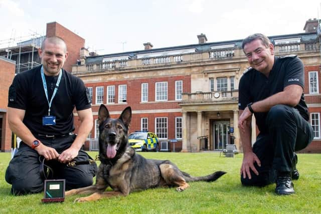 PC Sean Foster (left) with PD Nala and Chief Constable Nick Adderley (right).