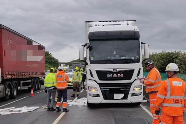 Crews work to mop up 400 litres of diesel from the M1 on Tuesday afternoon