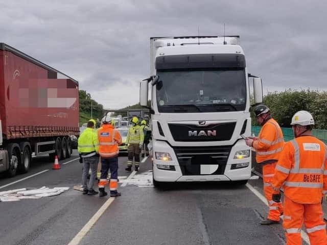 Crews work to mop up 400 litres of diesel from the M1 on Tuesday afternoon