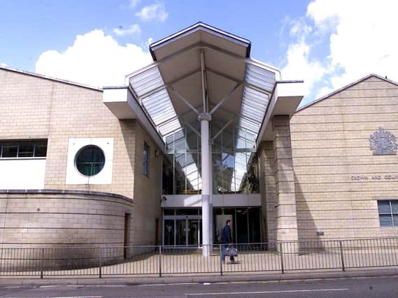 A trial has begun over the alleged rape of a woman in a Northampton bedsit.