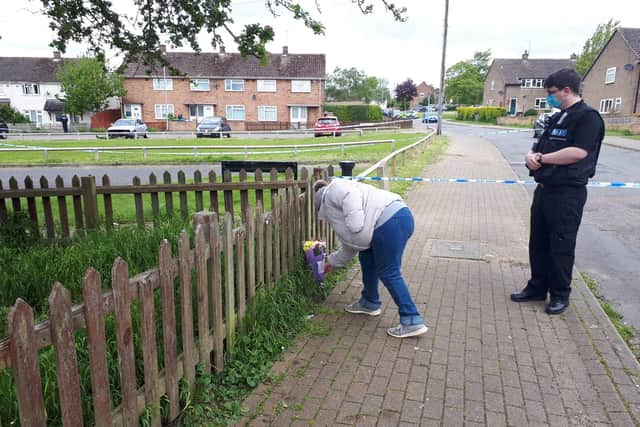 Karen Ruthven leaving flowers at the scene.