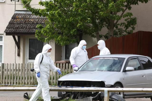 Forensics officers at the scene.