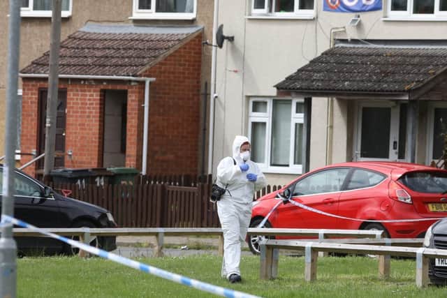 Forensics officers at the scene.