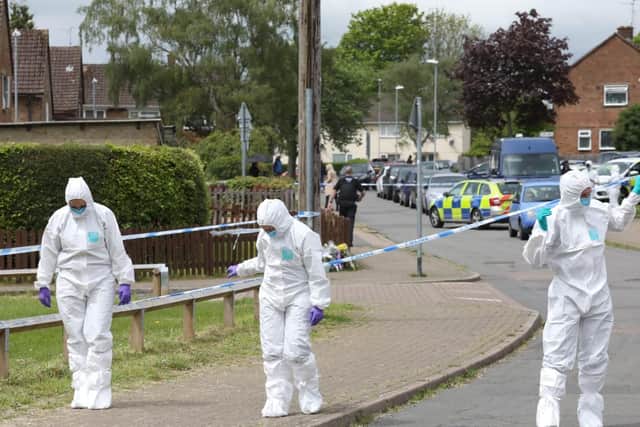 Forensics officers at the scene.