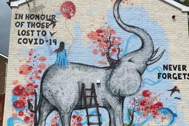 The mural on the side of Nick's home.