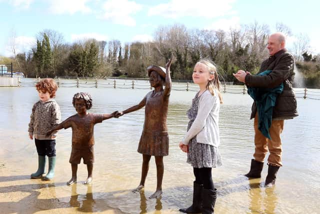 The lake restoration project marked with unveiling of the statue of children by the children who posed for the sculpture l-r Victor Groves, 5, and Megan Phillips, 9, unveiled the sculpture helped by Oliver Wicksteed (chairman of Wicksteed Charitable Trust) March 31 2015
