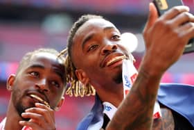 Ivan Toney savours Brentford's promotion to the Premier League with team-mate Tariqe Fosu at Wembley on Saturday