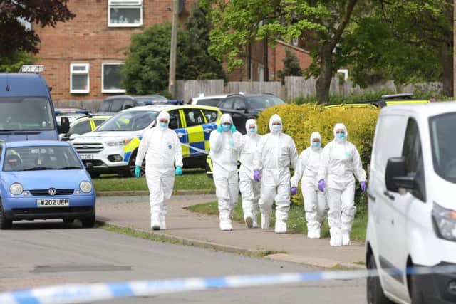 Forensic investigators at the scene.