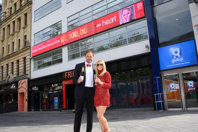 Heart Breakfast presenters Jamie Theakston and Amanda Holden toast Shelley Humphries outside the Leicester Square studios